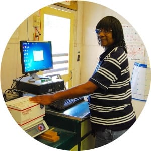 Gloria standing at shipping computer